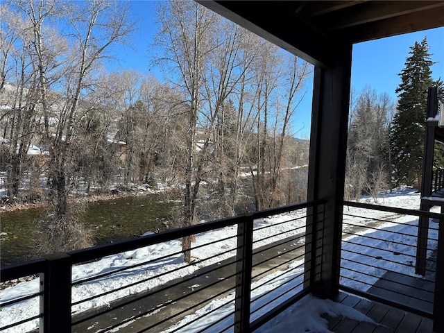 view of snow covered deck