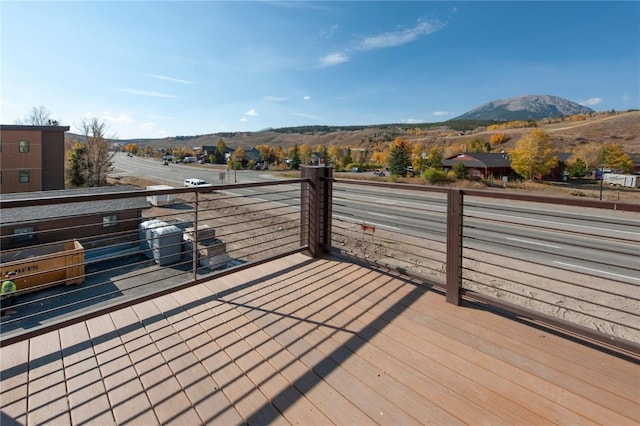 wooden deck featuring a mountain view