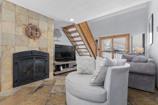 living room with a tiled fireplace