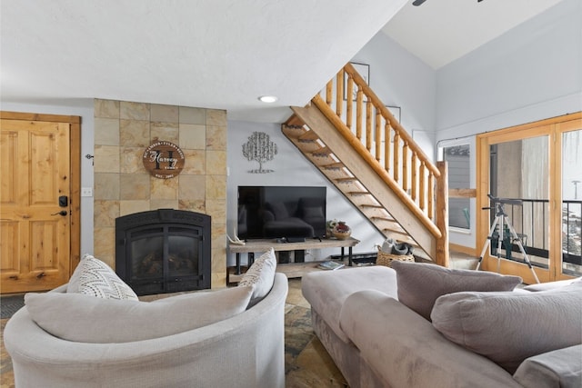 living room with a tile fireplace