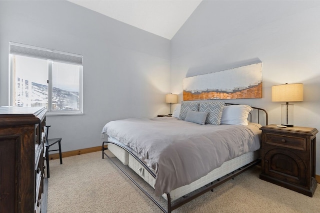 carpeted bedroom featuring vaulted ceiling