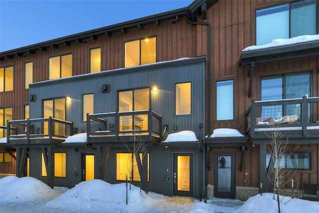 view of front of home featuring a balcony and board and batten siding