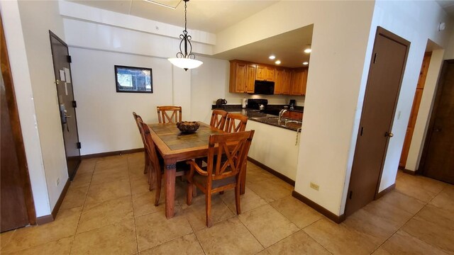 tiled dining room with sink