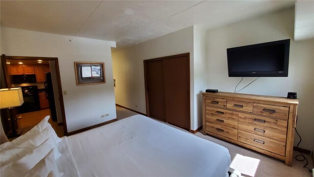 bedroom featuring light carpet