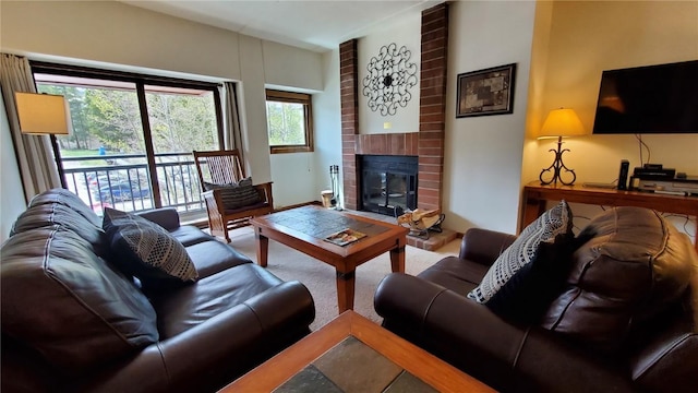 living room with a brick fireplace