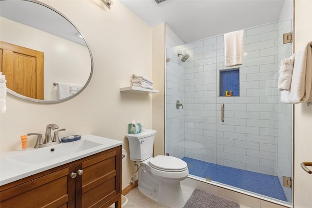 bathroom with tile patterned flooring, vanity, toilet, and walk in shower