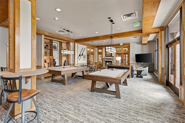 rec room with a fireplace, plenty of natural light, beamed ceiling, and pool table