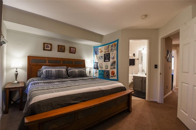 carpeted bedroom with ensuite bathroom