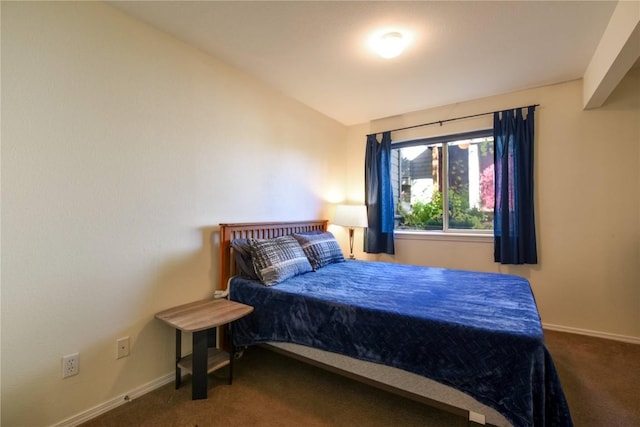 carpeted bedroom featuring lofted ceiling