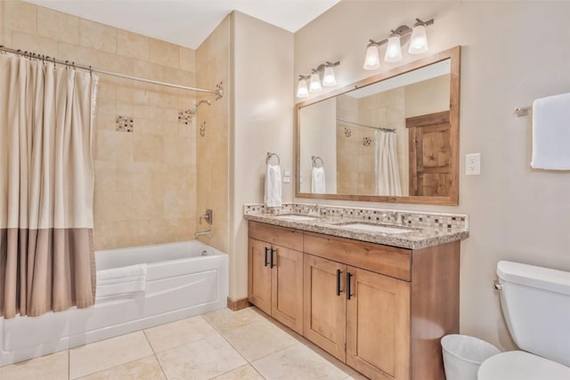 full bathroom with tile patterned floors, toilet, vanity, and shower / bath combo