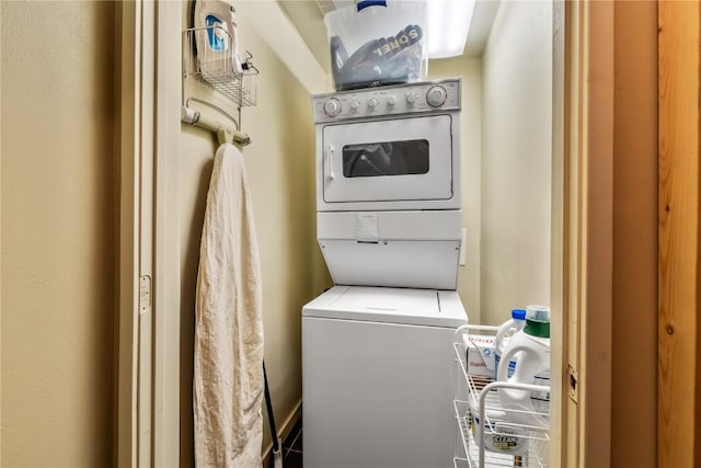 laundry area featuring stacked washing maching and dryer