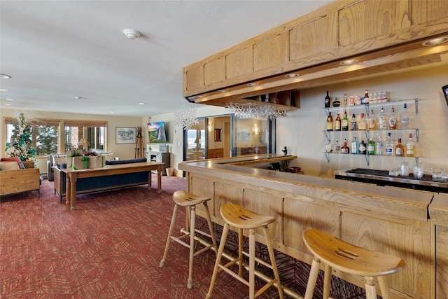 bar with light brown cabinetry