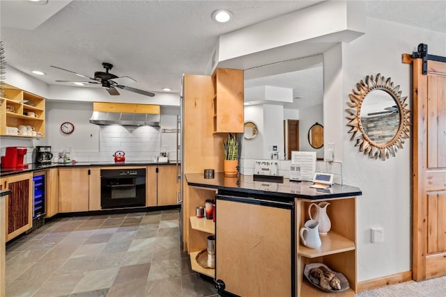 kitchen with black oven, ceiling fan, backsplash, wine cooler, and exhaust hood