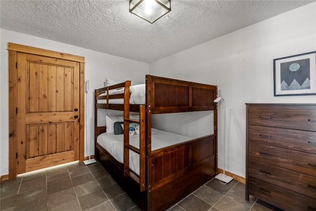 bedroom featuring a textured ceiling