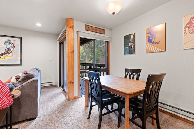 carpeted dining area featuring a baseboard radiator