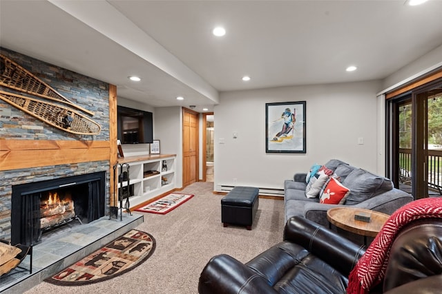 living room with carpet flooring, a stone fireplace, and a baseboard heating unit