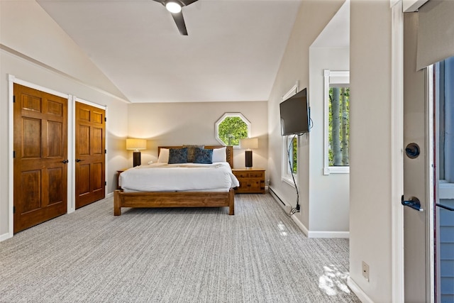 bedroom featuring light colored carpet, a baseboard radiator, ceiling fan, and lofted ceiling