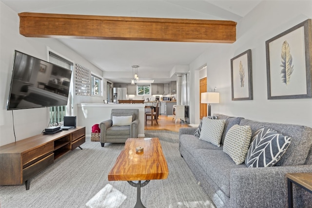 living room with beam ceiling