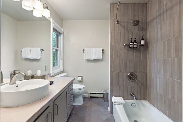 full bathroom featuring baseboard heating, tile patterned flooring, toilet, vanity, and tiled shower / bath