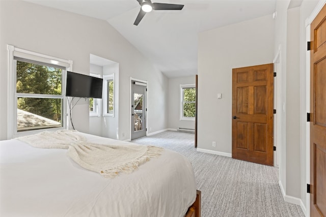 carpeted bedroom with baseboard heating, ceiling fan, and lofted ceiling