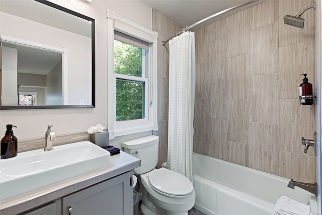 full bathroom featuring vanity, toilet, and shower / tub combo with curtain