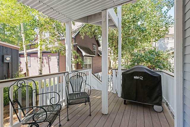 wooden deck with grilling area