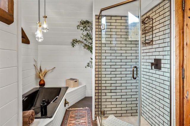 bathroom with wood walls and plus walk in shower