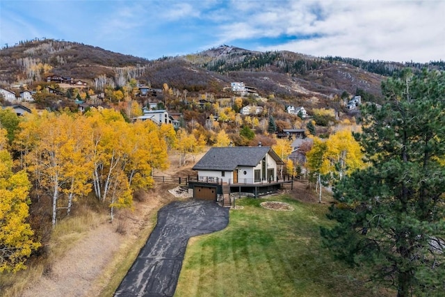 birds eye view of property with a mountain view