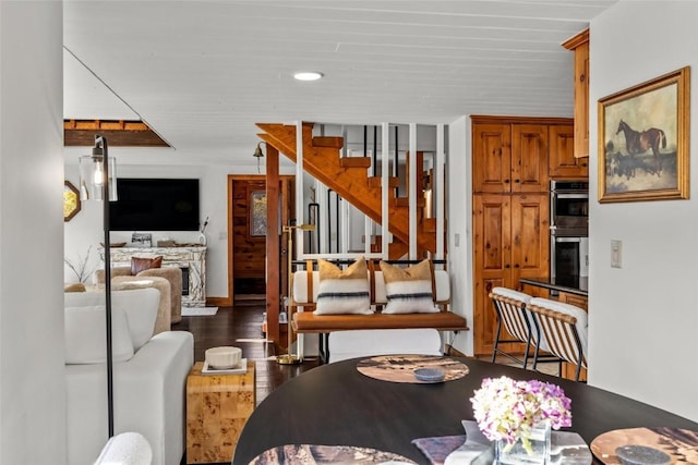 living room with dark hardwood / wood-style floors