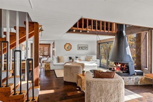 living room featuring a fireplace and dark hardwood / wood-style flooring