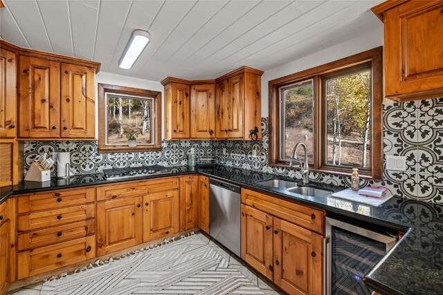 kitchen with dark stone counters, sink, wine cooler, tasteful backsplash, and stainless steel appliances