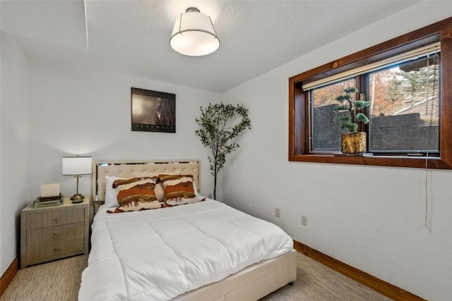 bedroom with light wood-type flooring