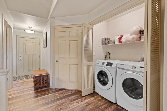 washroom featuring separate washer and dryer and hardwood / wood-style flooring