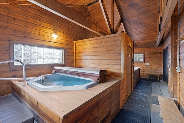 miscellaneous room featuring wooden walls, wooden ceiling, a hot tub, and lofted ceiling