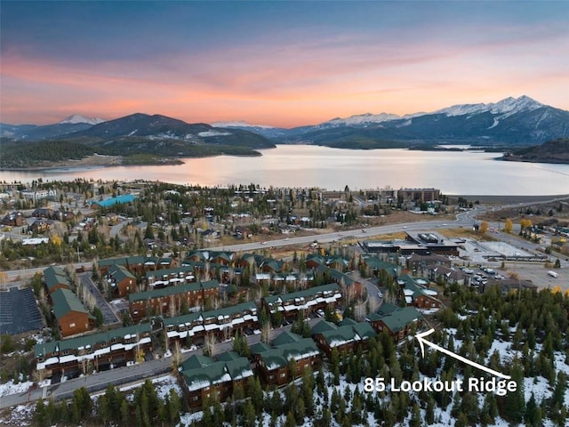 aerial view at dusk with a water and mountain view