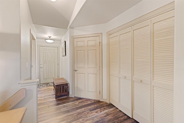 hallway with dark hardwood / wood-style floors