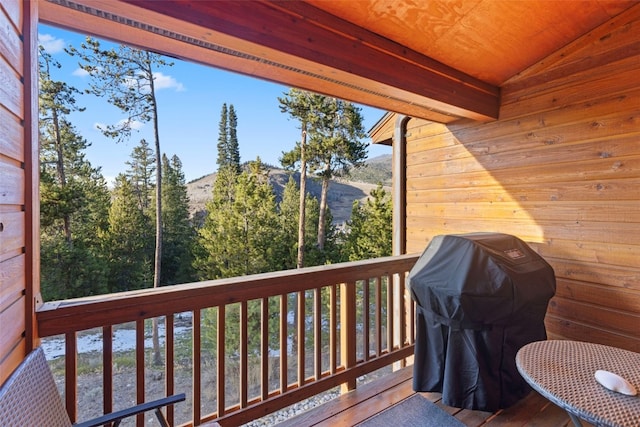 wooden terrace featuring grilling area