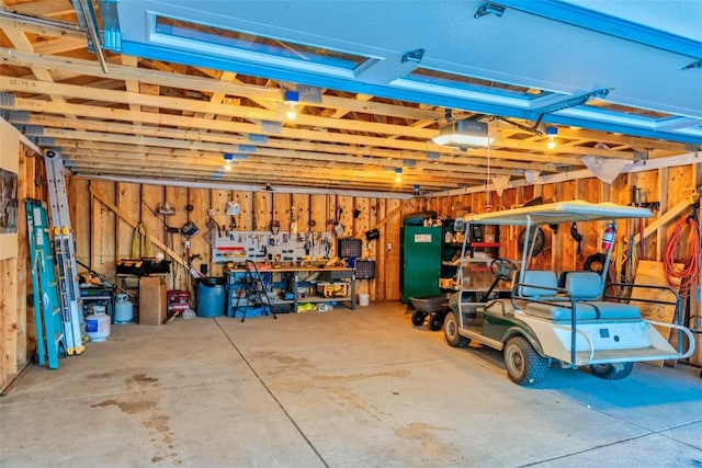 garage featuring a workshop area and a garage door opener