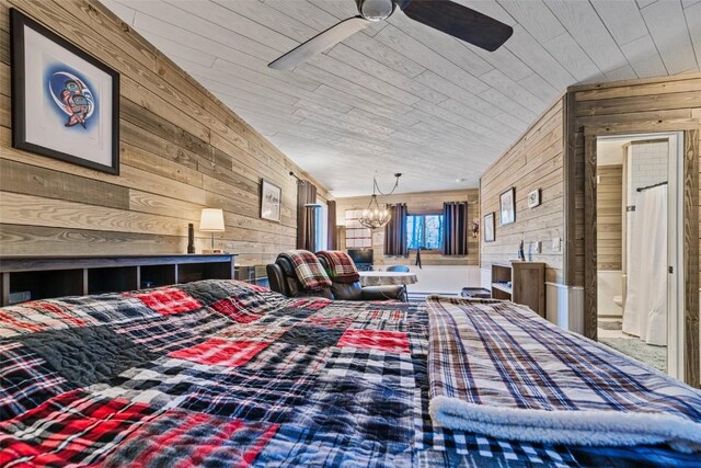 bedroom with ceiling fan with notable chandelier, wood walls, wooden ceiling, and lofted ceiling