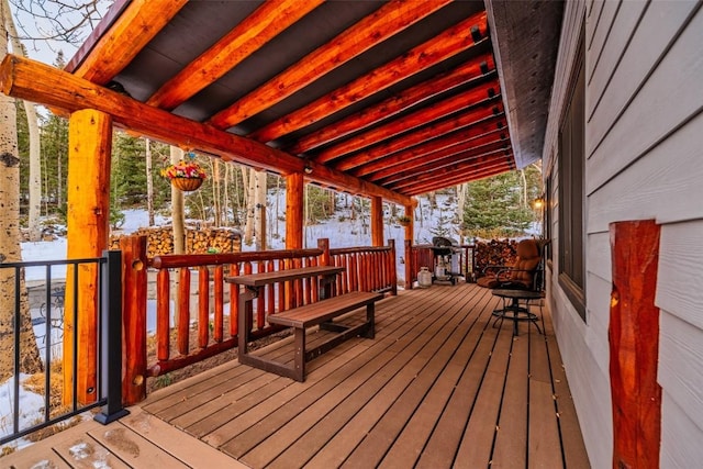 view of snow covered deck