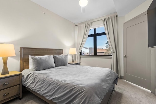 carpeted bedroom featuring ceiling fan