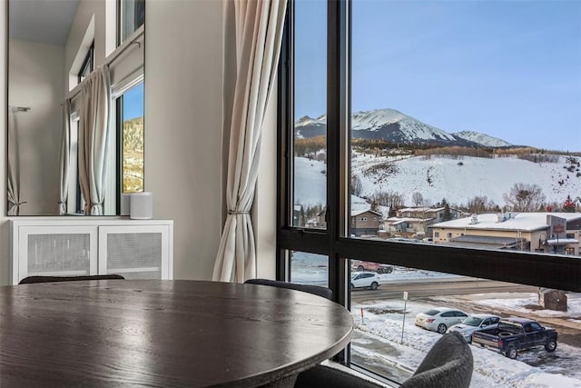 unfurnished dining area with a mountain view