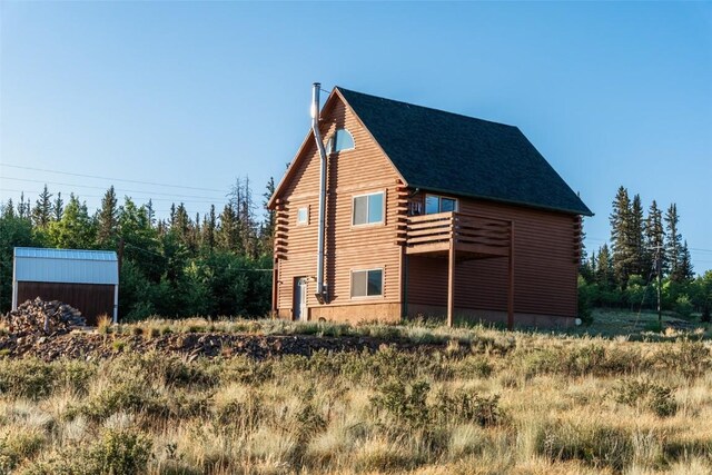 view of home's exterior featuring log siding