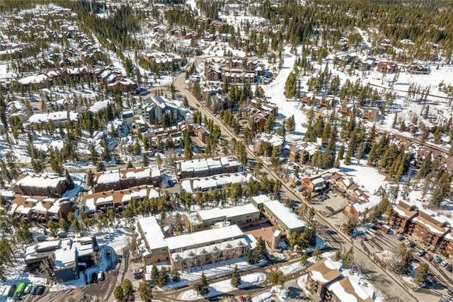 snowy aerial view with a residential view