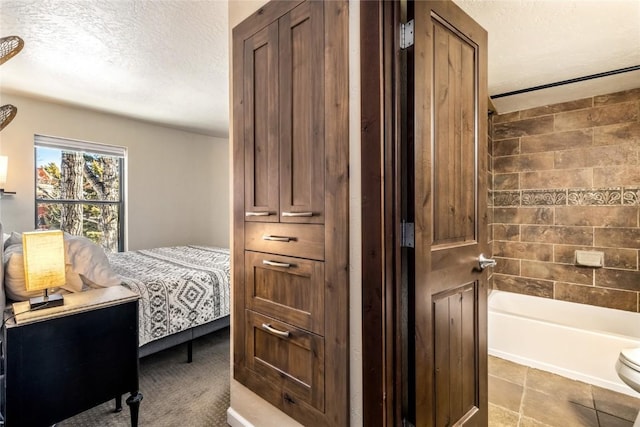 bedroom featuring a textured ceiling