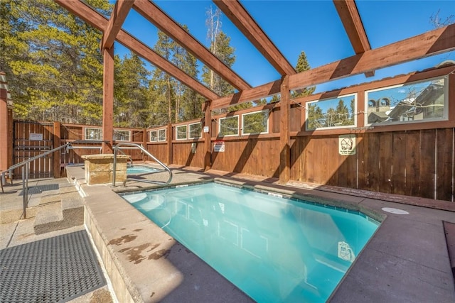 view of swimming pool featuring a fenced in pool, a patio, and a fenced backyard