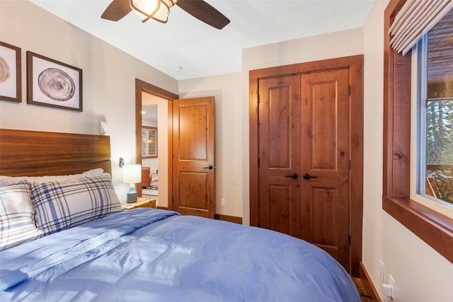 bedroom with ceiling fan and a closet