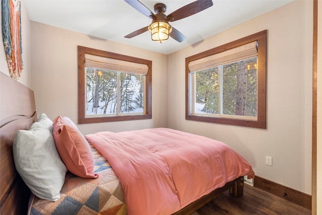 bedroom featuring dark hardwood / wood-style floors and ceiling fan