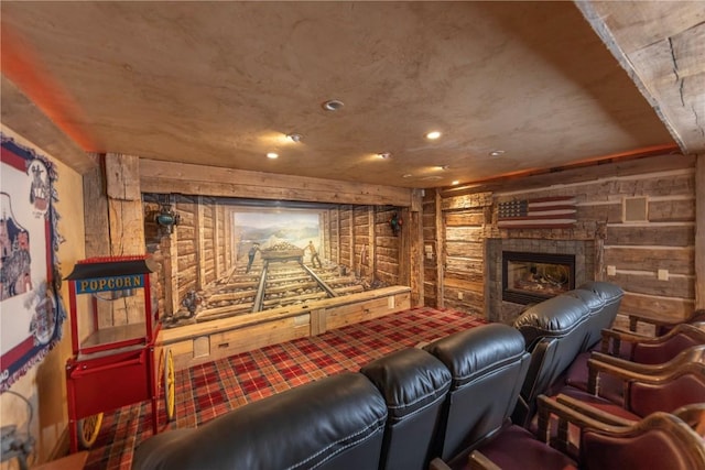 home theater room with a fireplace