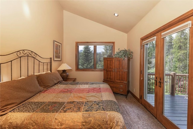 carpeted bedroom with access to exterior, multiple windows, french doors, and vaulted ceiling